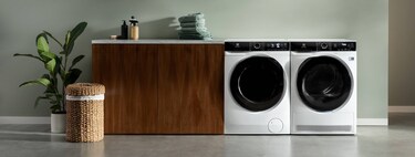 minimalistic laundry room with washing machine and tumble dryer